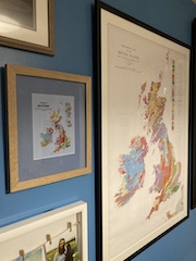 Framed cross stitch next to original map