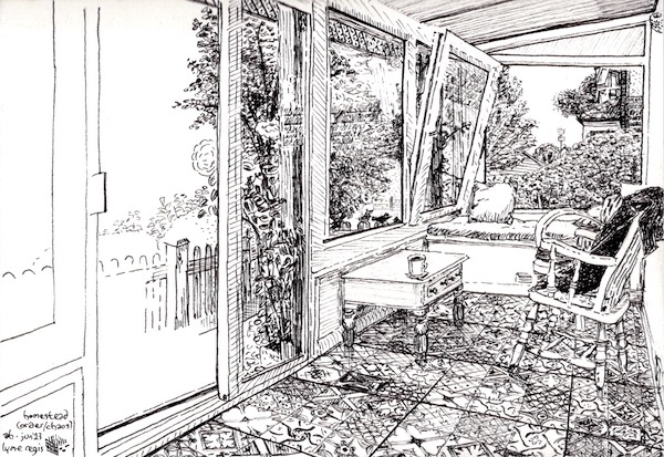 A tidy conservatory with intricate floor tiles and minimal furniture, looking out onto trees, rosebushes and hints of nearby houses. There are three blackbirds just outside one window.