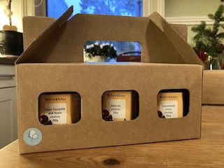 Three chutney jars in a cardboard container