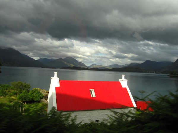 Red roof by Scottish loch