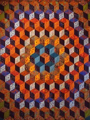Colourful quilt hexagon pattern by Kaffe Fassett