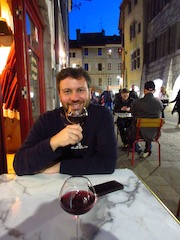 Andrew drinking wine in Annecy
