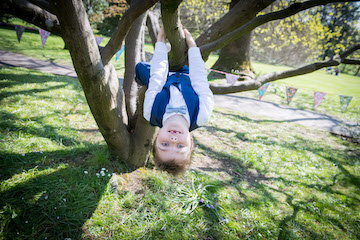 Best man swinging from a tree